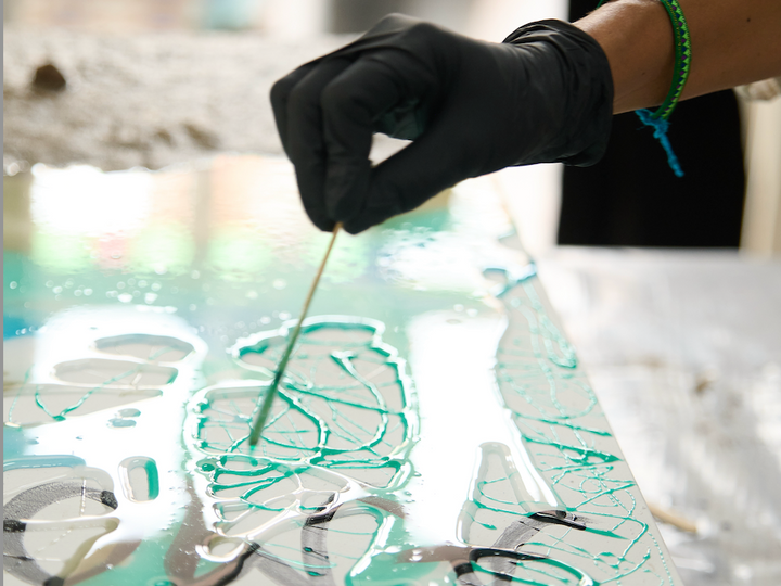 Artist working with epoxy resin, common mistakes with resin