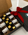 Aqua Pigments Collection en su caja de regalo negra con lazo rojo y los frascos cuentagotas