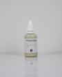 Stone Pigments Collection: frasco del pigmento Golden Sand sobre fondo blanco
